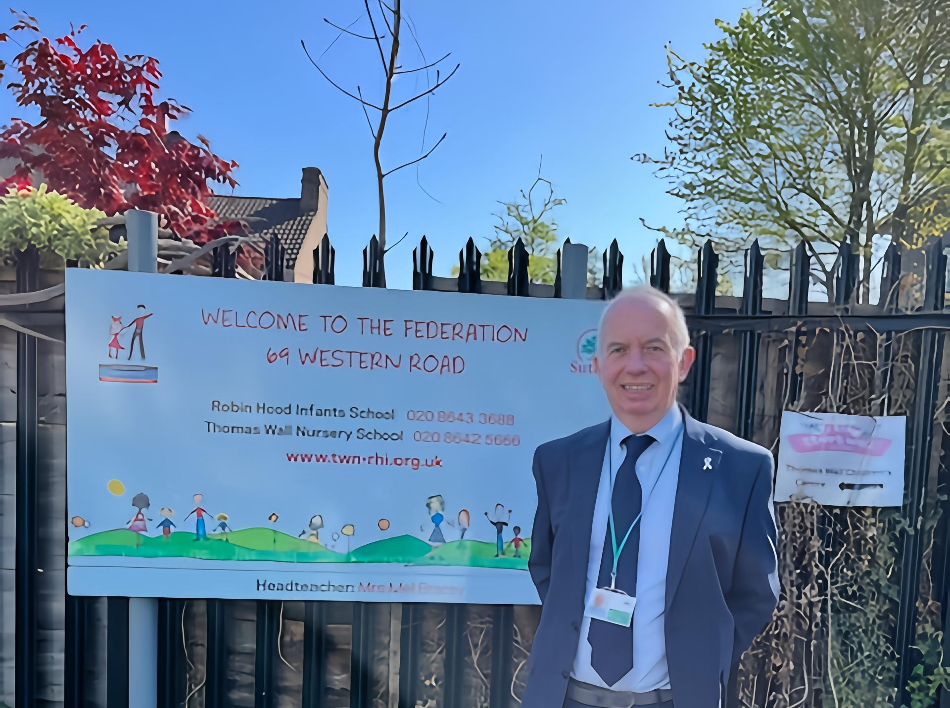 Leader of the Council, Councillor Barry Lewis outside Robin Hood Infants School